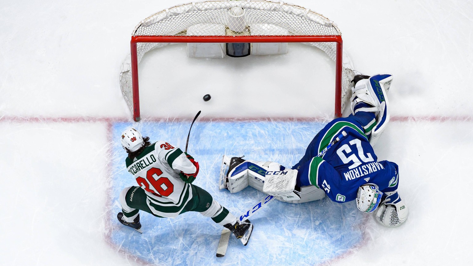 VANCOUVER, BC - FEBRUARY 19: Minnesota Wild Right Wing Mats Zuccarello 36 scores a shootout goal on Vancouver Canucks Goaltender Jacob Markstrom 25 during their NHL, Eishockey Herren, USA game at Roge ...
