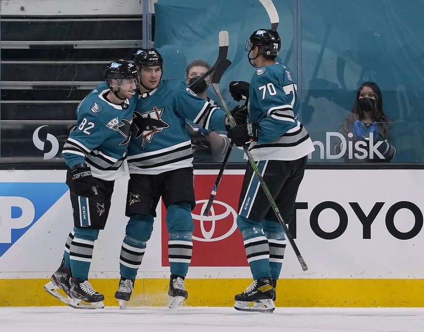 San Jose Sharks right wing Timo Meier, center, celebrates with Ivan Chekhovich (82) and Alexander True (70) after scoring a goal against the Arizona Coyotes during the second period of an NHL hockey g ...