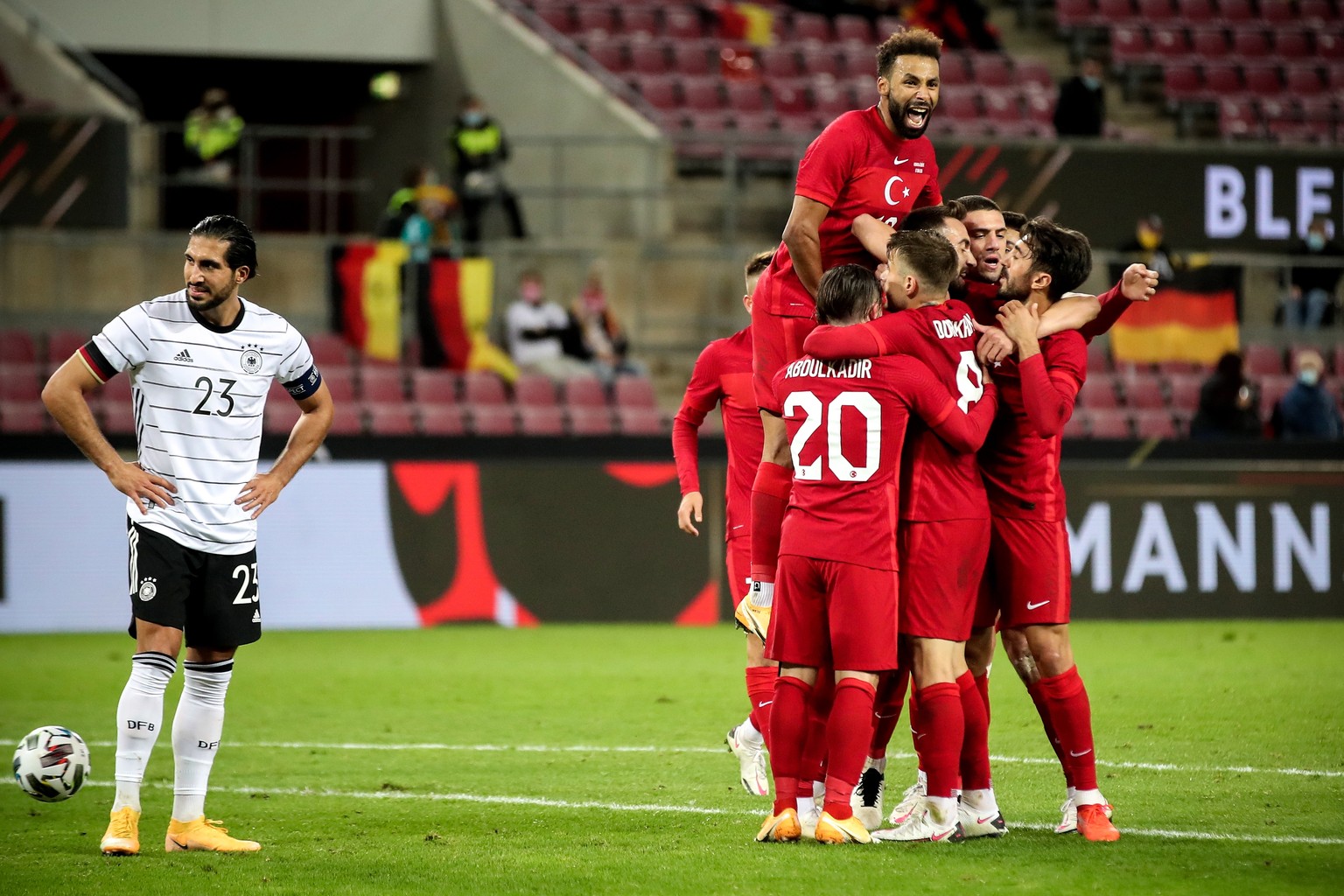 epa08727911 Germany&#039;s Emre Can (L) reacts as Turkey?s Kenan Karaman (hidden) and his teammates celebrate scoring the 3-3 equalizer during the international friendly soccer match between Germany a ...