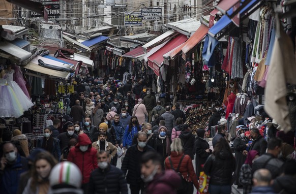 epa09108672 People walk at the Tahtakale Bazaar in Istanbul, Turkey, 31 March 2021. The Turkish lira traded at 8,36 Liras against the US dollar on 31 March. EPA/ERDEM SAHIN