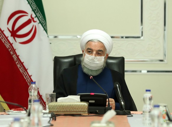HANDOUT - Präsident Hassan Ruhani während einer Sitzung des Nationalen Komitees zur Bekämpfung des Coronavirus. Foto: -/Iranian Presidency/dpa - ATTENTION: editorial use only and only if the credit me ...