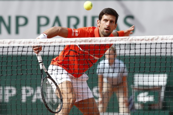 Serbia&#039;s Novak Djokovic plays a shot against Poland&#039;s Hubert Hurkacz during their first round match of the French Open tennis tournament at the Roland Garros stadium in Paris, Monday, May 27 ...