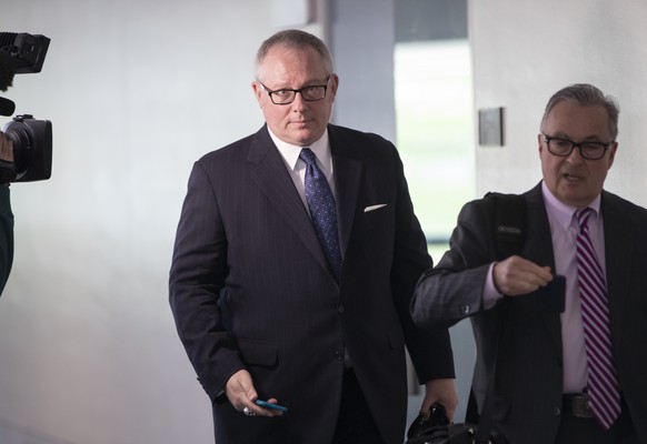 FILE - In this May 1, 2018, file photo, Former Donald Trump campaign official Michael Caputo, left, joined by his attorney Dennis C. Vacco, leaves after being interviewed by Senate Intelligence Commit ...