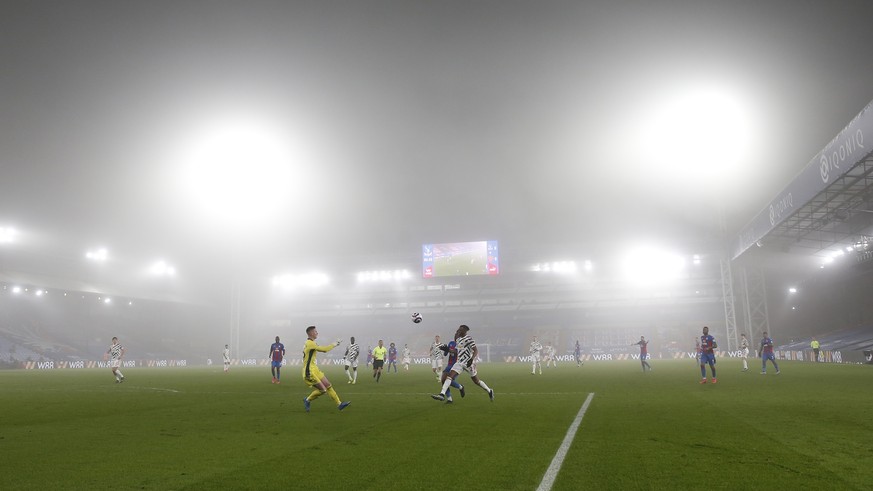 Foggy conditions during the English Premier League soccer match between Crystal Palace and Manchester United at Selhurst Park stadium in London, England, Wednesday, March 3, 2021. (Matthew Childs/Pool ...