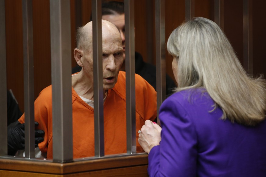 Joseph James DeAngelo, charged with being the Golden State Killer, talks with his attorney, Diane Howard, during his appearance in Sacramento County Superior Court in Sacramento, Calif., Thursday, Mar ...