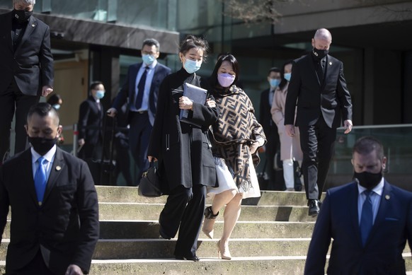 Chief Financial Officer of Huawei, Meng Wanzhou, centre right, leaves British Columbia Supreme Court during a break from her extradition hearing, in Vancouver, British Columbia, Wednesday, March 31, 2 ...