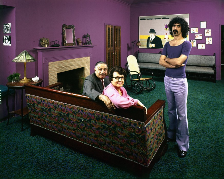 American avant garde and rock musician Frank Zappa (1940 - 1993) poses with his parents Francis Zappa (1905 - 1973) and Rose Marie Zappa (nee Colimore, 1912 - 2004) in his home, Los Angeles, Californi ...