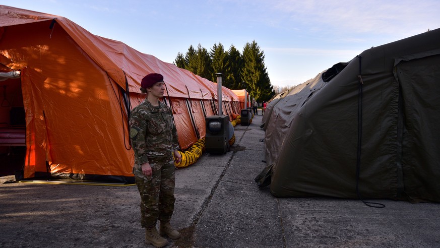 epa08301738 View of mobile hospital tents with a total capacity for 120 beds set up by the Slovenian Army at the Edvard Peperko Barracks in Ljubljana, Slovenia, 17 March 2020. The Slovenian government ...