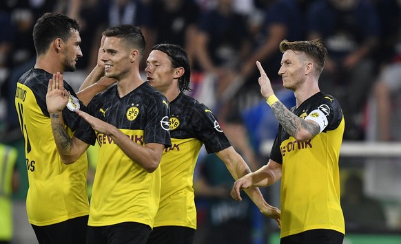 Dortmund&#039;s Marco Reus, right, celebrates his opening goal with teammate Mats Hummels, left, during the German soccer cup, DFB Pokal, first Round match between KFC Uerdingen 05 and Borussia Dortmu ...
