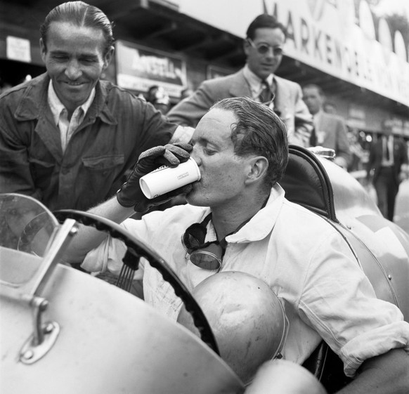 Swiss racing driver Baron Emmanuel &quot;Toulo&quot; de Graffenried (1914-2007) drinks to his victory at the Swiss Grand Prix near Bremgarten in the canton of Berne, Switzerland, pictured in 1939. (KE ...