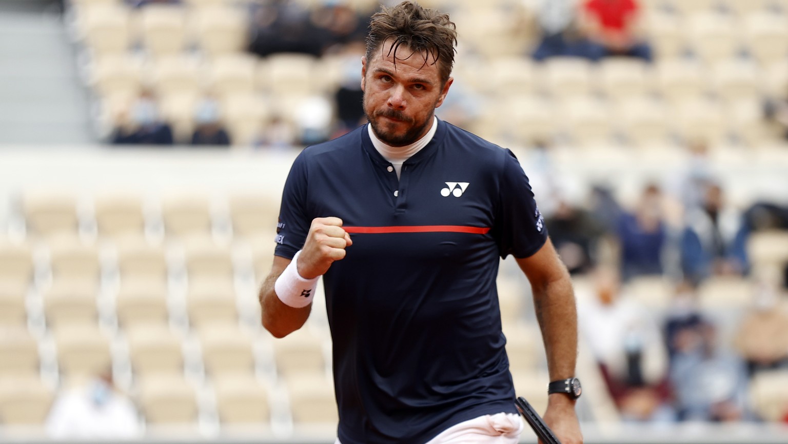 epa08708190 Stan Wawrinka of Switzerland reacts as he plays Dominik Koepfer of Germany during their men?s second round match during the French Open tennis tournament at Roland ?Garros in Paris, France ...