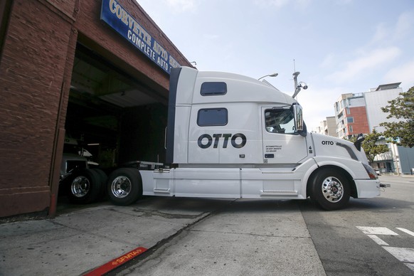 One of Otto&#039;s self-driving, big-rig trucks leaves the garage for a test drive during a demonstration at the Otto headquarters on Thursday, Aug. 18, 2016, in San Francisco. Uber announced that it  ...