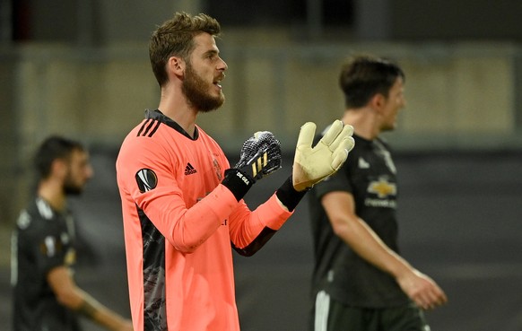 epa08608252 Goalkeeper David de Gea of Manchester react after the 1-2 during the UEFA Europa League semi final match between Sevilla FC and Manchester United in Cologne, Germany, 16 August 2020. EPA/I ...