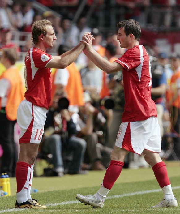 Switzerland&#039;s Alexander Frei, right, leaves the pitch in the last minutes for Mauro Lustrinelli, left, during the Group G match Togo against Switzerland on Monday, June 19, 2006 in the Westfalen  ...