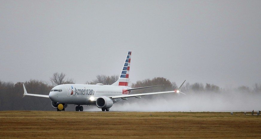 An American Airlines Boeing 737 Max takes off at Tulsa International Airport to fly to Dallas Wednesday, Dec. 2, 2020 in Tulsa, Okla.. Earlier the plane had flown a group of journalists and American A ...