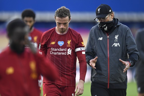 Liverpool&#039;s manager Jurgen Klopp and Liverpool&#039;s Jordan Henderson leave the field at the end of the English Premier League soccer match between Everton and Liverpool at Goodison Park in Live ...