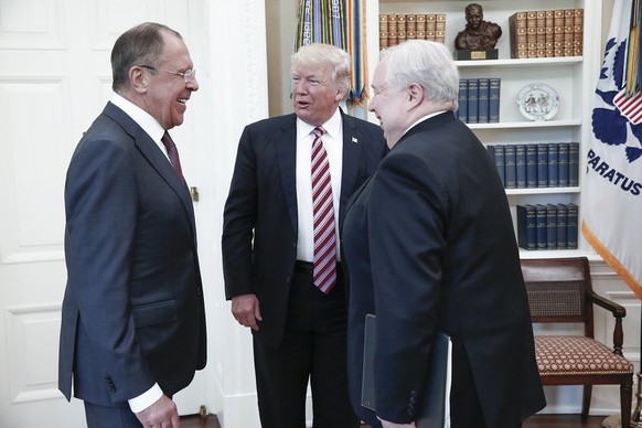 epa05967423 (FILE) - A file handout photo made available by the Russian Foreign Ministry shows US President Donald J. Trump (C) speaking with Russian Foreign Minister Sergei Lavrov (L) and Russian Amb ...