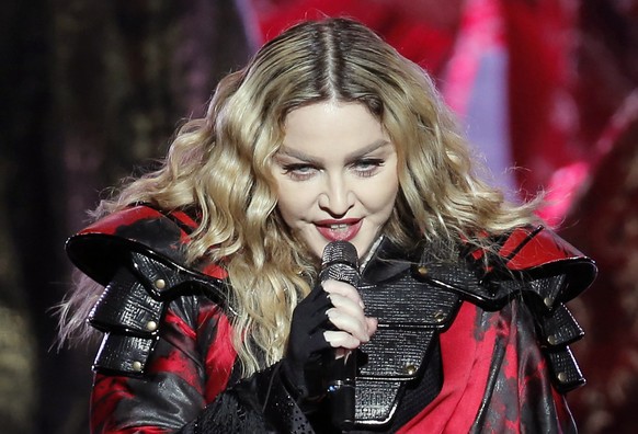 FILE - In this Feb. 20, 2016 file photo, U.S. singer Madonna performs during the Rebel Heart World Tour in Macau. Pop star Madonna has made surprise visits to Manila shelters for orphans and street ch ...
