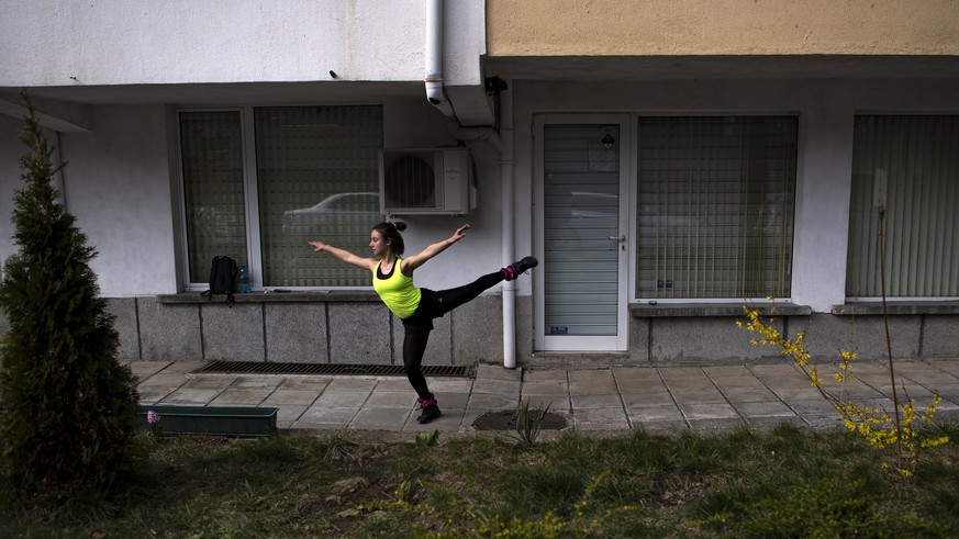 epa08330472 Bulgarian figure skater Elena Dimitrova practices in front of her house in Sofia, Bulgaria, 29 March 2020. The Bulgarian Government introduced a state of emergency as officially confirmed  ...