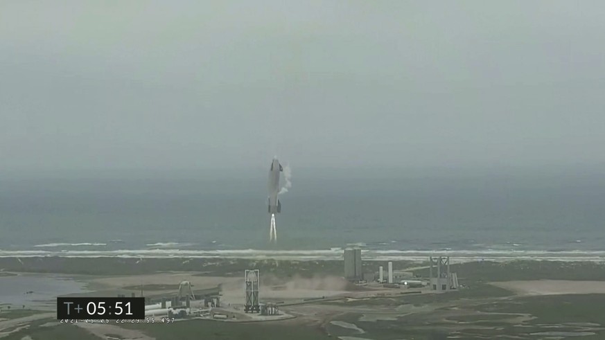 In this image from video made available by SpaceX, a Starship test vehicle descends during a flight test in Boca Chica, Texas on Wednesday, May 5, 2021. (SpaceX via AP)