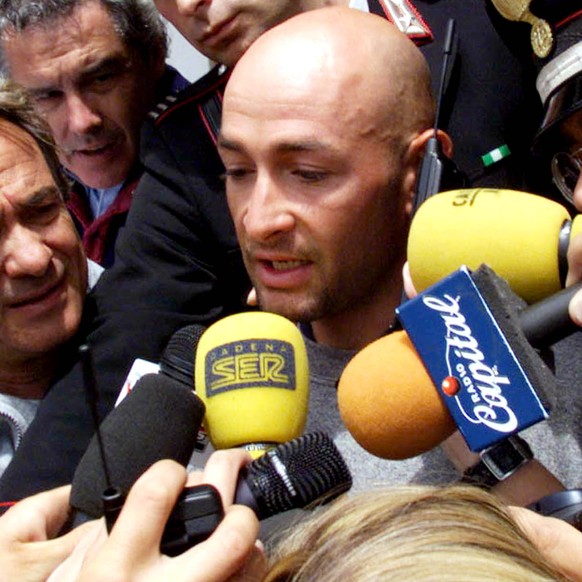 Italy&#039;s Marco Pantani answers media questions as he leaves his hotel in Madonna di Campiglio Saturday, June 5, 1999, after he was banned from the Tour of Italy cycling race after tests showed unu ...