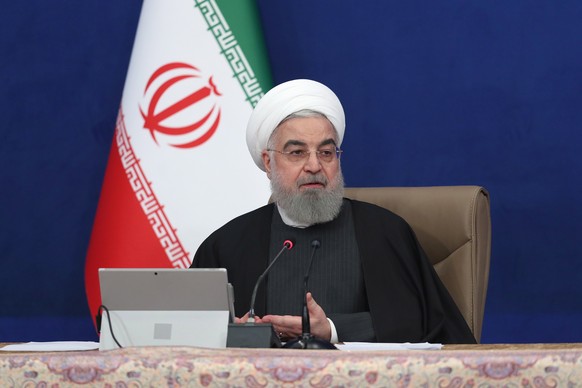 epa08900828 A handout photo made available by the presidential office shows Iranian President Hassan Rouhani speaking during the cabinet meeting in Tehran, Iran, 23 December 2020. Rouhani gave assuran ...