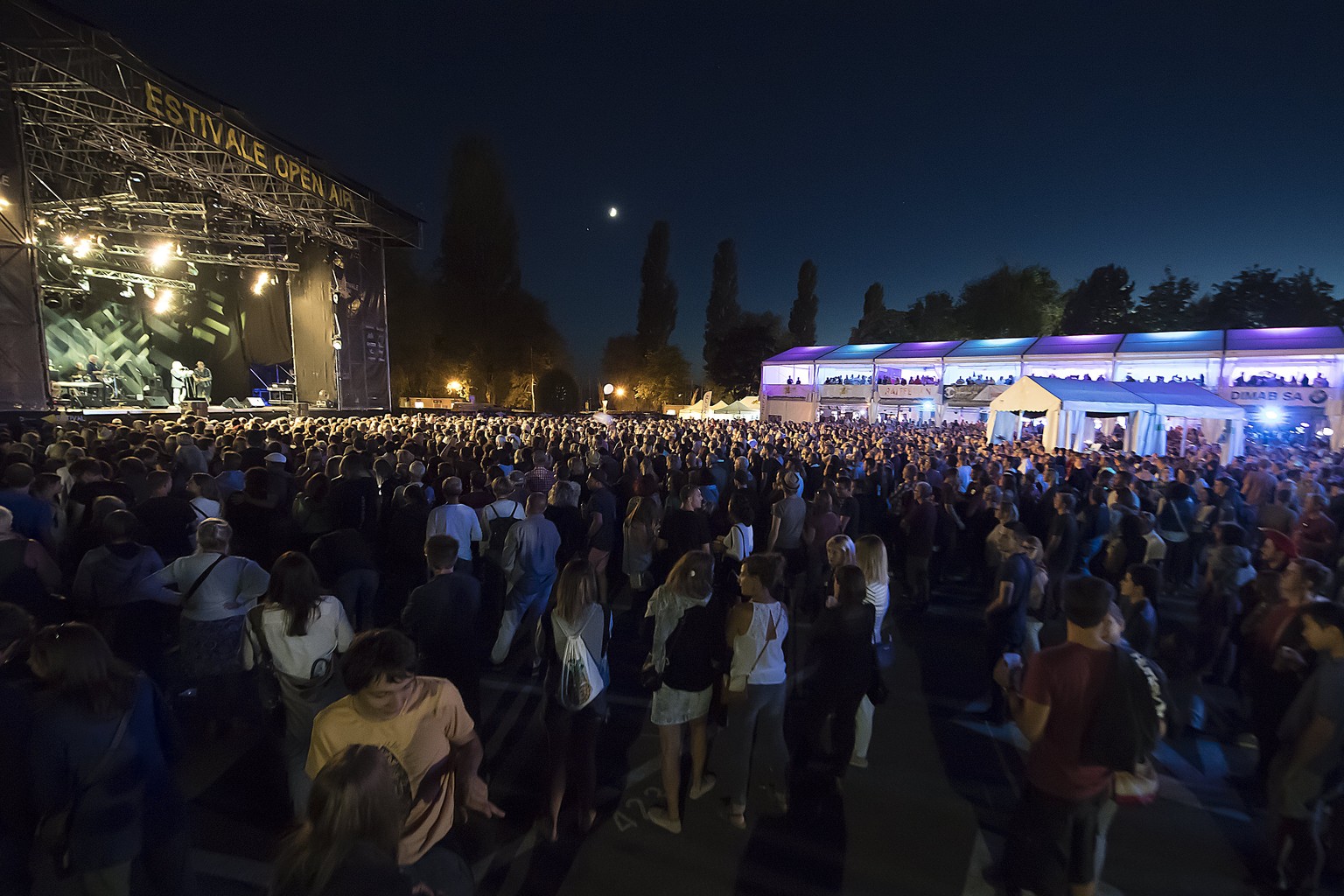 epa06115458 Festival-goers crowd the main stage during the concert of the US singer-songwriter Patti Smith at the Estivale Open Air, in Estavayer-le-Lac, Switzerland, 28 July 2017. The music festival  ...