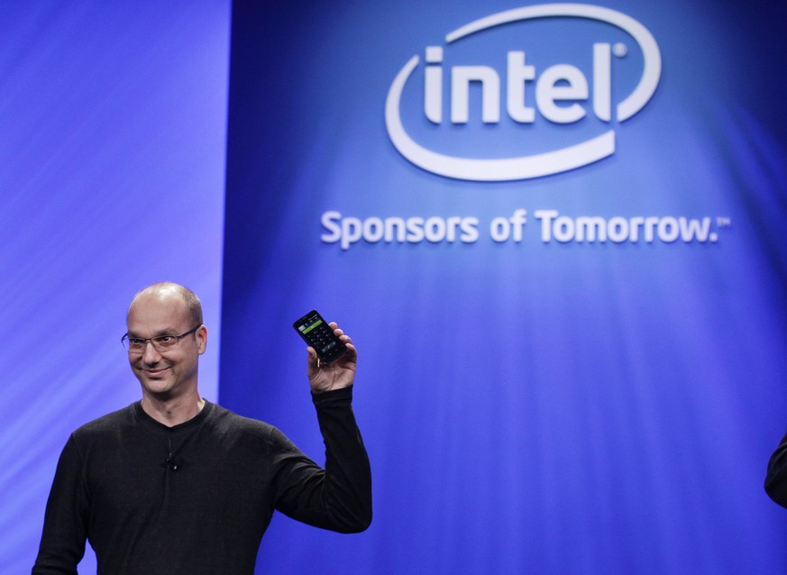 FILE - In this Tuesday, Sept. 13, 2011 file photo, Google Senior Vice President of Mobile, Andy Rubin, holds up a Google Android phone running on an Intel chip at the Intel Developer Forum in San Fran ...