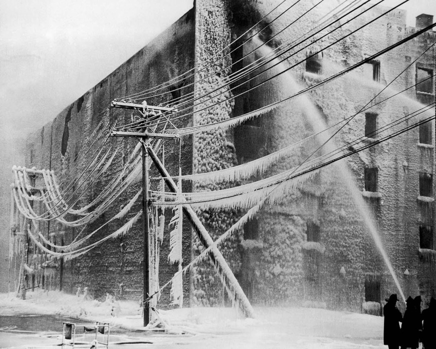 Firefighters battle a blaze in Albany, New York. 1940.
