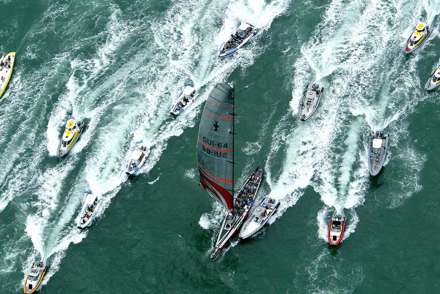 Switzerland&#039;s Alinghi with a small support flotilla heads back to the viaduct harbor after winning the America&#039;s Cup in Auckland, New Zealand, Sunday, March 2, 2003. Alinghi completed a five ...