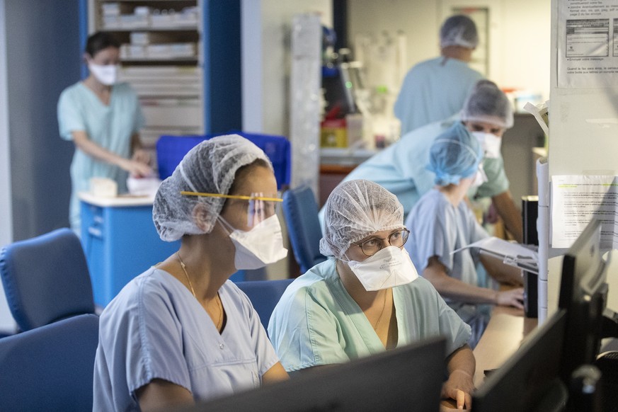Medical staff work in COVID-19 area of the Nouvel Hospital Civil of Strasbourg, eastern France, Tuesday, Sept.15, 2020. France is grappling with the double headache of trying revive its COVID-battered ...