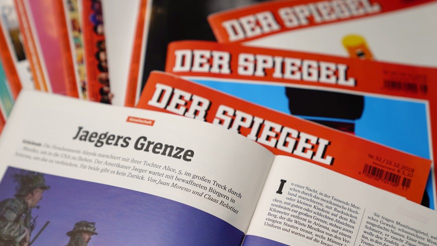 epa07240335 An illustrative picture shows the article &#039;Jaegers Grenze&#039; (Hunters&#039; Border) by Juan Moreno and Claas Relotius in the German magazine &#039;Der Spiegel&#039; (issue No. 47 f ...