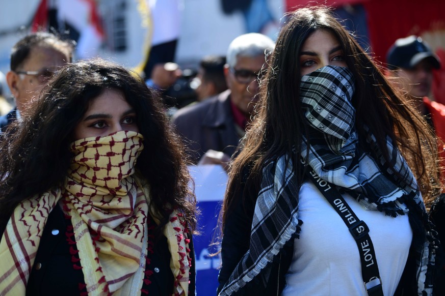 epa08215014 Iraqi women take part in a demonstration at the Al-Tahrir square in central Baghdad, Iraq, 13 February 2020. Hundreds of Iraqi women staged a demonstration in central Baghdad to support th ...
