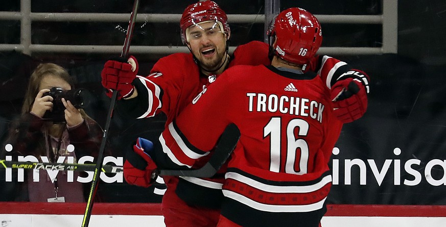 Carolina Hurricanes&#039; Nino Niederreiter (21) celebrates his game-tying goal against the Dallas Stars with teammate Vincent Trocheck (16) during the third period of an NHL hockey game in Raleigh, N ...