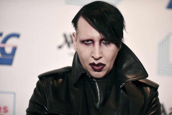 FILE - In this Dec. 10, 2019, file photo, Marilyn Manson attends the 9th annual &quot;Home for the Holidays&quot; benefit concert in Los Angeles. Detectives are investigating Manson for allegations of ...
