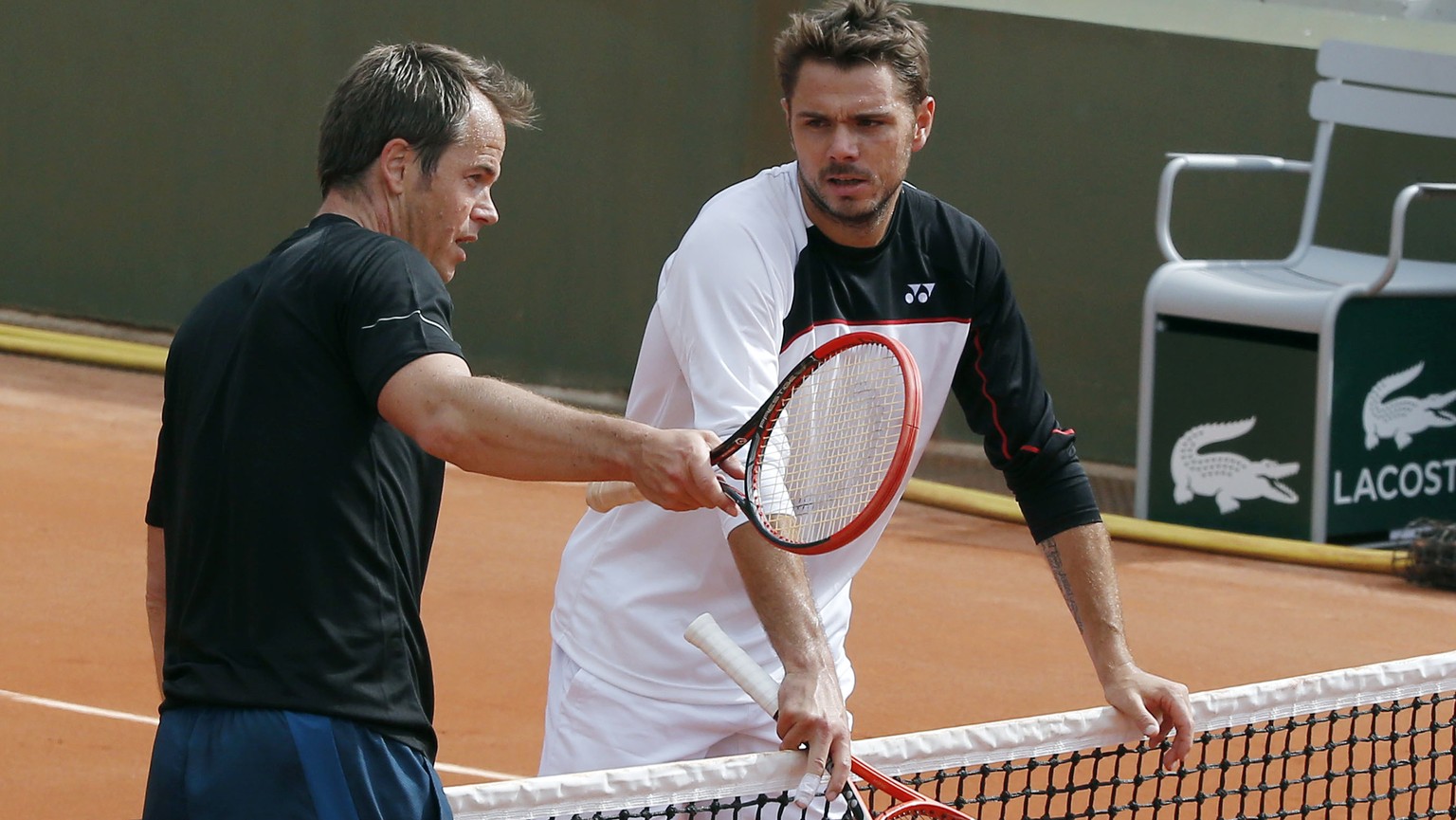 FILE - In this May 24, 2014, file photo, Stanislas Wawrinka, right, listening to his coach Magnus Norman during a training session for the French Open tennis tournament at Roland Garros in Paris. Wawr ...