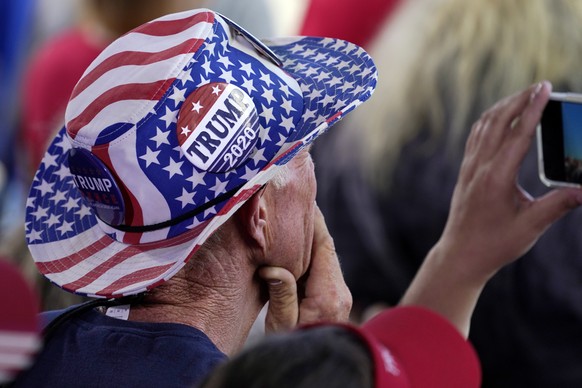 A supporter listens as President Donald Trump speaks during a campaign rally at Dayton International Airport, Monday, Sept. 21, 2020, at Dayton, Ohio. (AP Photo/Alex Brandon)
Donald Trump