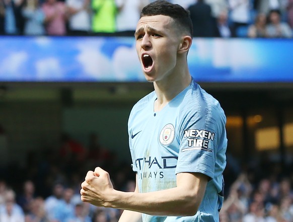 epa07517288 Manchester City&#039;s Phil Foden celebrates scoring a goal during the English Premier League soccer match between Manchester City and Tottenham Hotspur at the Etihad Stadium in Manchester ...