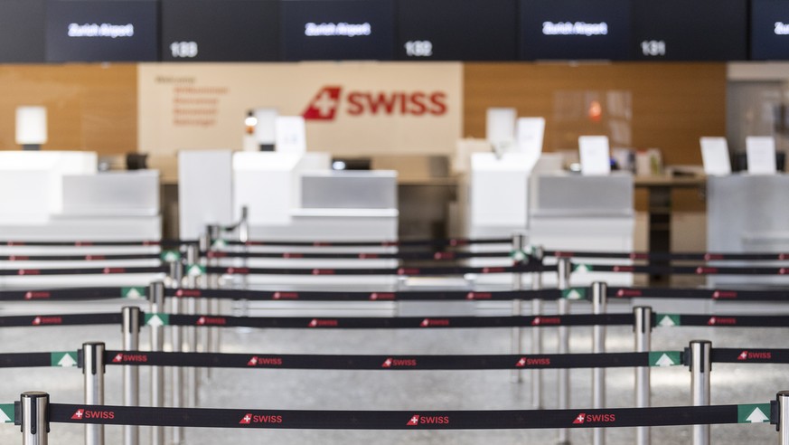 epa08368413 View of the emtpy airport in Zurich, Switzerland, 17 April 2020. A large number Swiss International Air Lines have grounded planes due to the spread of the SARS-CoV-2 coronavirus which cau ...