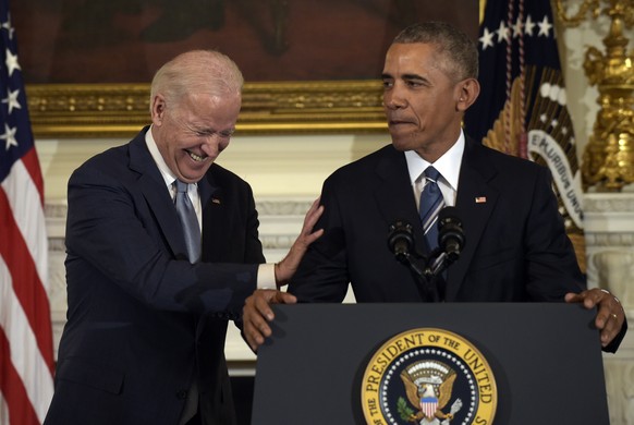 Vice President Joe Biden laughs as President Barack Obama talks about him during a ceremony in the State Dining Room of the White House in Washington, Thursday, Jan. 12, 2017. Obama surprised Biden an ...
