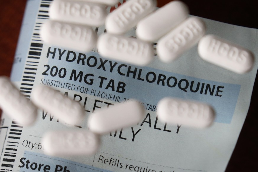 FILE - This Monday, April 6, 2020, file photo shows an arrangement of Hydroxychloroquine pills in Las Vegas. At least 13 states have obtained a total of more than 10 million doses of malaria drugs to  ...