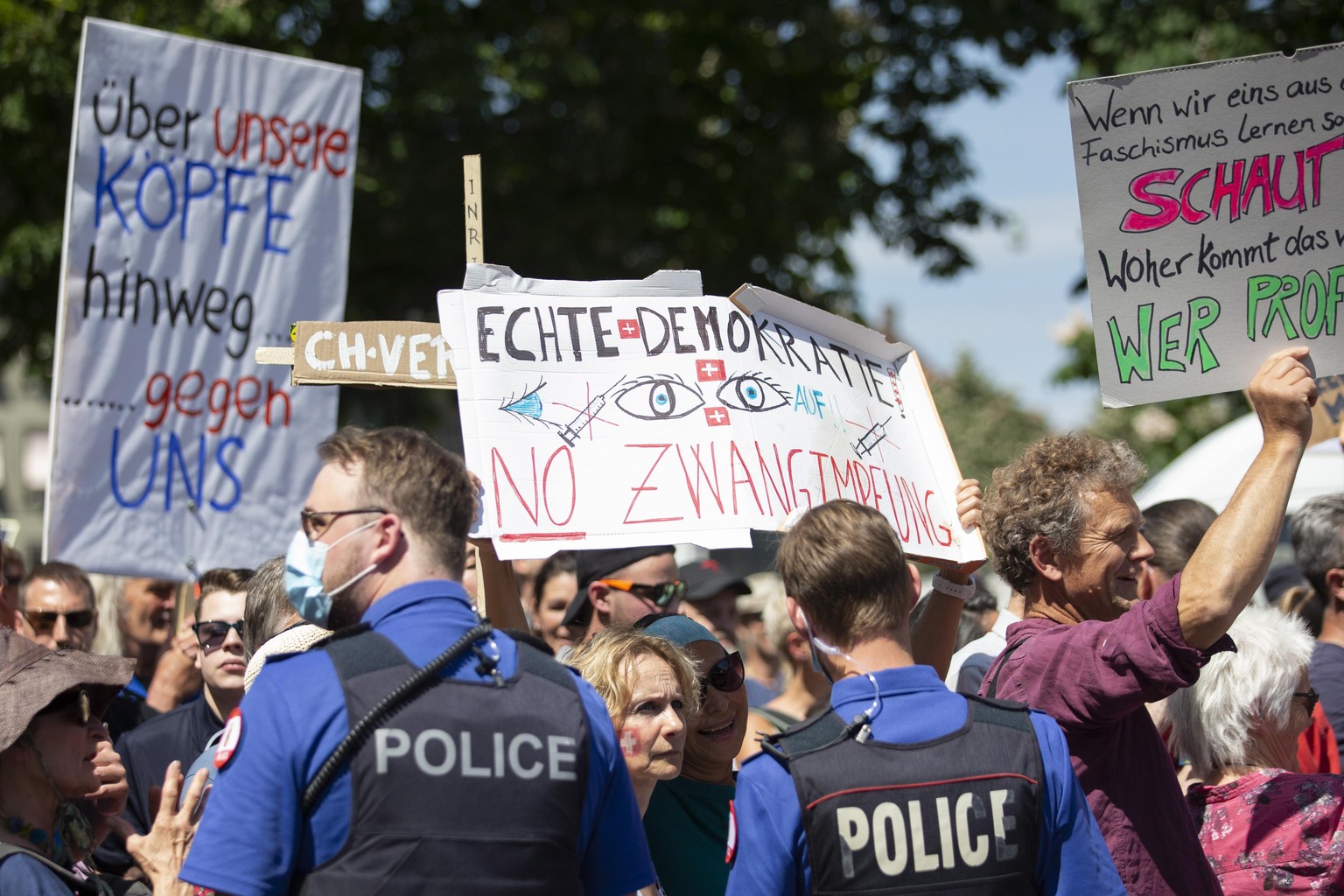 epa08412069 Several hundred demonstrators gathered in the center of Bern, Switzerland, to protest against the ongoing Corona-Lockdown, Saturday, May 9, 2020. The demonstrators asked for more freedom a ...