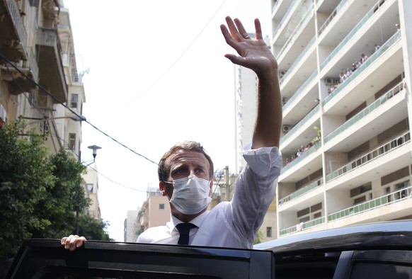 FILE - In this file photo dated Thursday Aug.6, 2020, French President Emmanuel Macron waves as he visits Beirut, Lebanon. Frenchman Alain Cocq who suffers from a long-term and incurable degenerative  ...