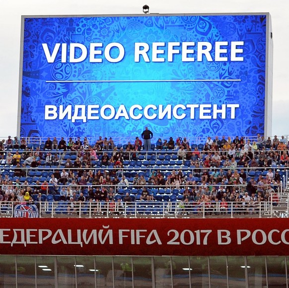 epa06037712 A video assistant referee (VAR) decision is announced on a huge screen during the FIFA Confederations Cup 2017 group B soccer match between Australia and Germany at the Fisht Stadium in So ...