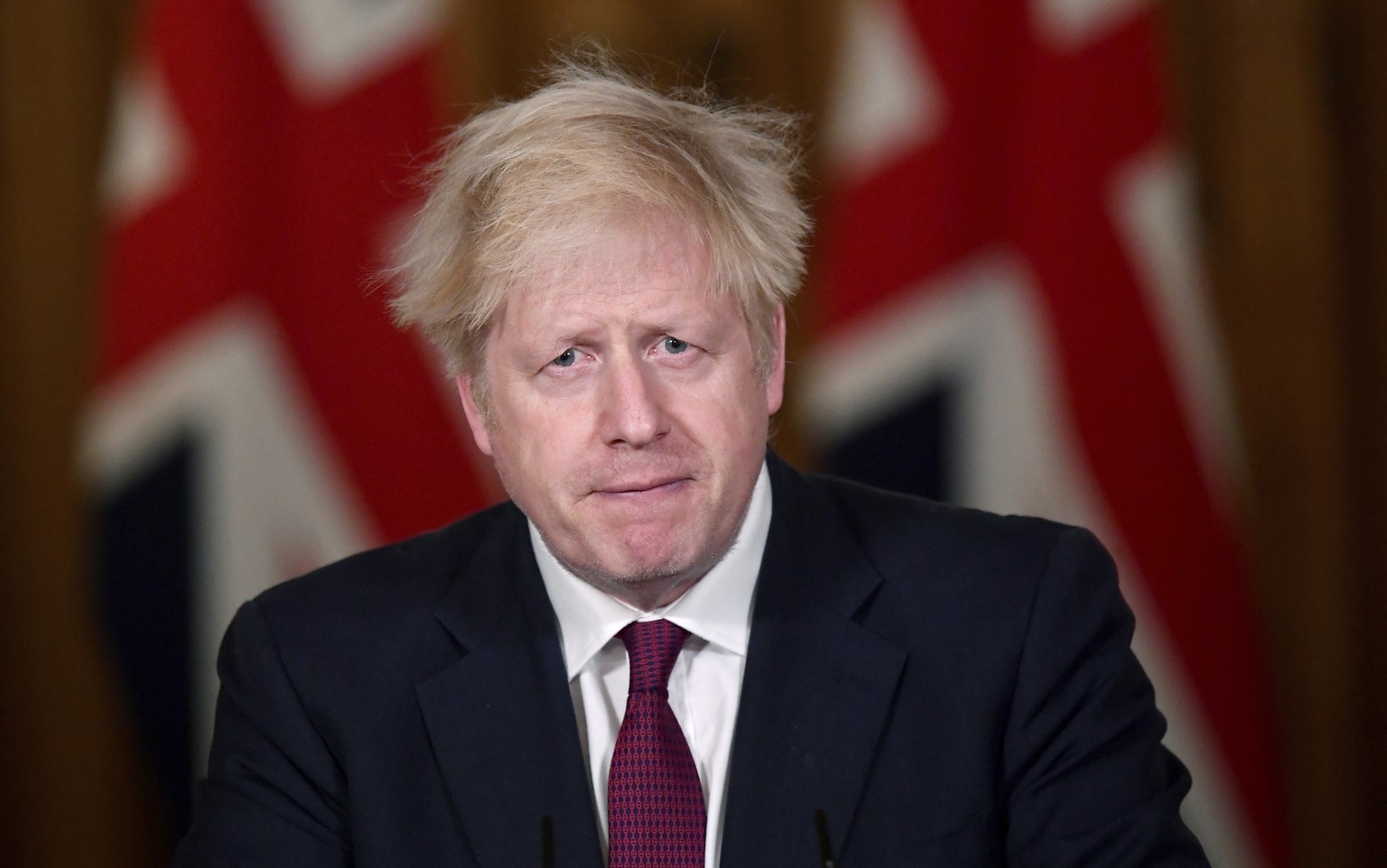 Britain&#039;s Prime Minister Boris Johnson speaks during a news conference in response to the ongoing situation with the coronavirus (COVID-19) pandemic, inside 10 Downing Street, London, Saturday, D ...