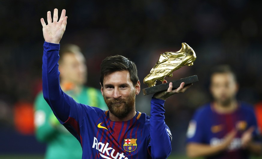 FC Barcelona&#039;s Lionel Messi holds up the Golden Shoe award, as the last season&#039;s leading goalscorer in league matches from the top division of every European national league, prior of the Sp ...