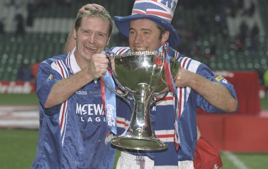18 Nov 1996: Paul Gascoigne (left) and teammate Ally McCoist pose with the trophy after the Scottish Coca Cola cup final between Rangers and Hearts at Celtic Park in Glasgow. Rangers won 4-3. Mandator ...