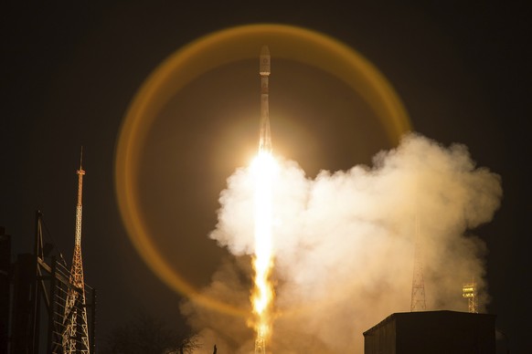 In this handout photo released by Roscosmos Space Agency Press Service, A Soyuz-2.1b launch vehicle takes-off with another 34 OneWeb satellites from the Baikonur Cosmodrome in Kazakhstan, Kazakhstan,  ...