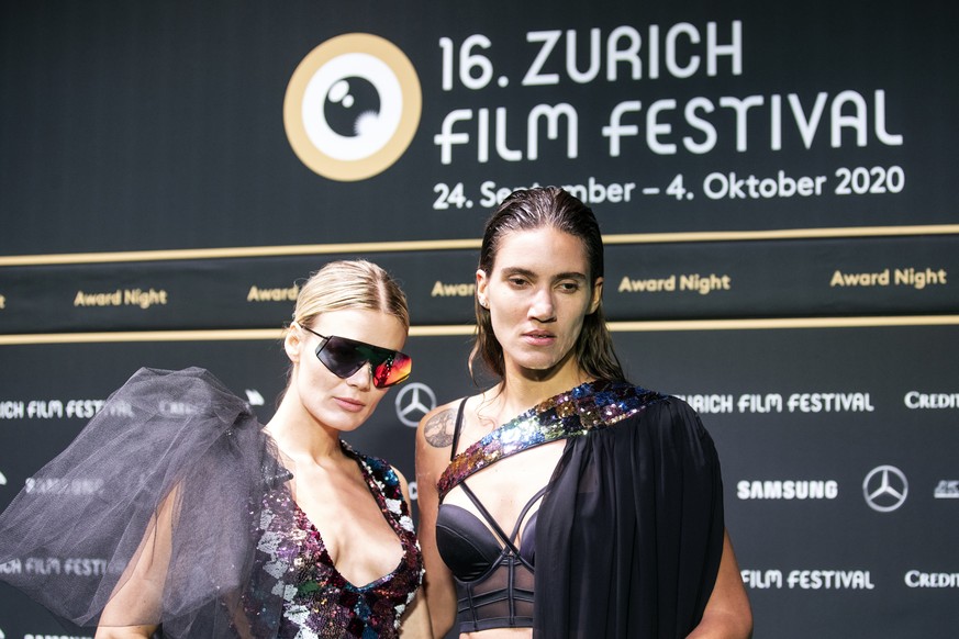 Swiss models Dominique Rinderknecht and Tamy Glauser, from left, pose on the Green Carpet during the Award Night ceremony at the 16th Zurich Film Festival (ZFF) in Zurich, Switzerland, Saturday, Octob ...