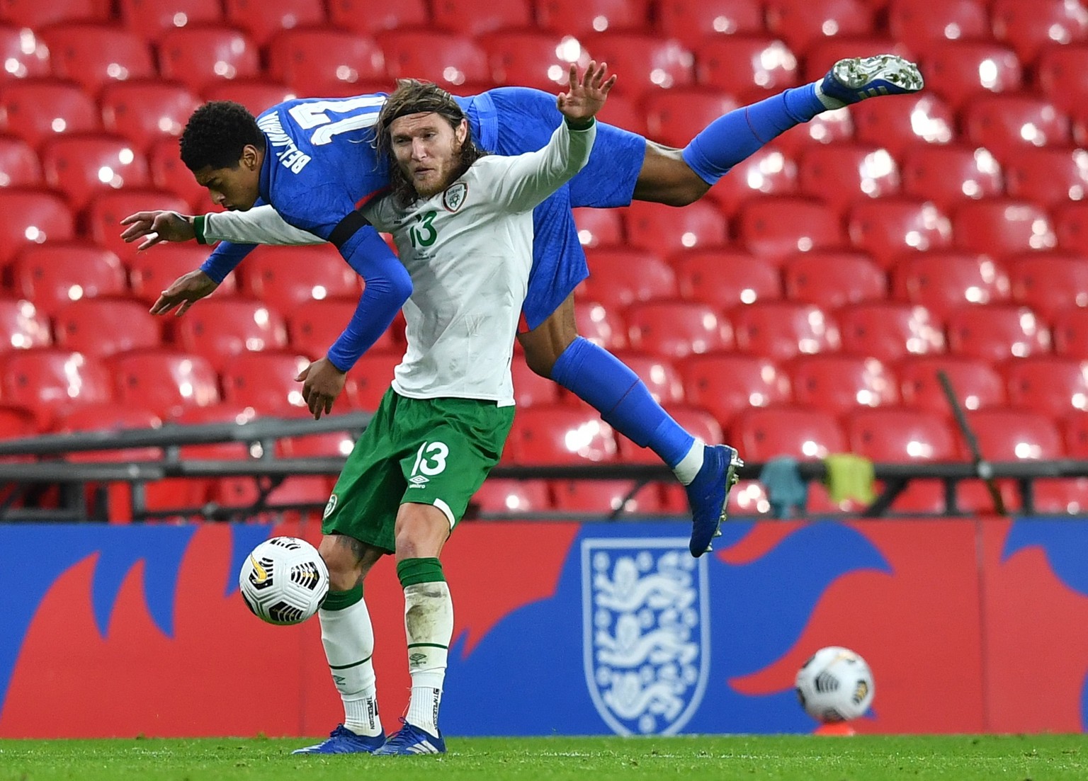 epa08816719 Jude Bellingham of England (L) in action against Jeff Hendrick of Ireland (R) during the international friendly match between England and Ireland at Wembley stadium in London, Britain, 12  ...
